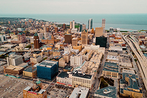 An aerial view of downtown Milwaukee with the lake in the background.